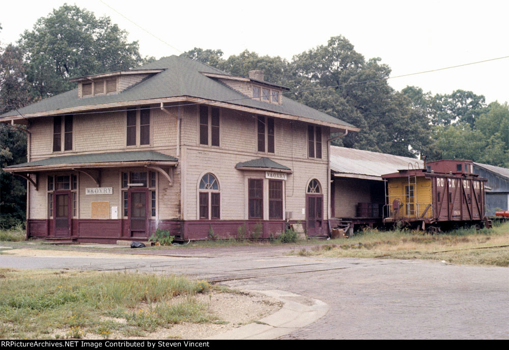 Warren & Ouchita Valley depot with Rock Island caboose.